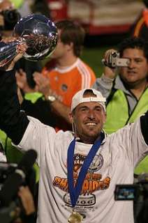 Paul Dalglish holds the trophy after the 2006 MLS Cup victory