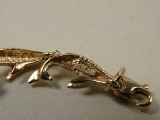 14KT YELLOW WYLAND HUMPBACK WHALES BRACELET. IN EXCELLENT WORKING 