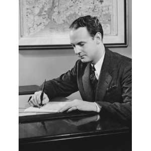  Young Businessman Sitting at Desk, Writing Photographic 