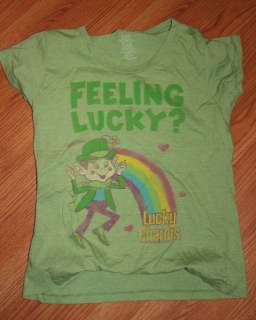 Nice lot of 2 Ts. Lucky Charms T is size XXL. The Snoopy T is a L 