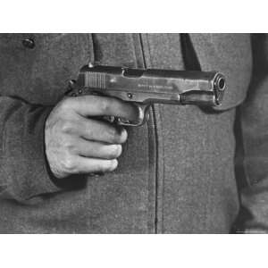 View of a Soldier Holding a US Army Colt Automatic .45 