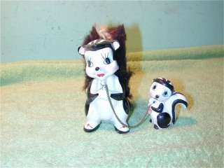 Vintage Skunks Mother & baby with chain Japan ceramic Fur on the tail 