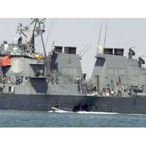  Experts in a Speed Boat Examine the Hull of the USS Cole 