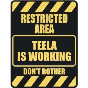   RESTRICTED AREA TEELA IS WORKING  PARKING SIGN