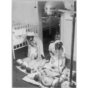  Nurses with babies under sunlamp, Germany
