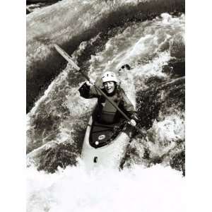  A Kayaker Careens over a Waterfall into the Swirling White 