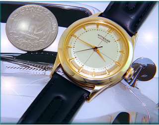 check picture of the actual watch next to a us $ 0 25cents quarter 