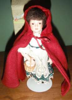   Avon Collectible Porcelain Red Riding Hood Tale Doll with Stand  