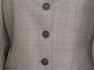   acetate, German interlinings, and horn blend buttons create a coat you