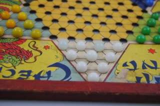 Vintage Chinese checkers game with marbles  