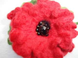 do flower brooches in lots of different colours, styles and sizes 