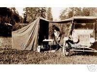 PHOTO OF A 1920S FLAPPER GIRL CAMPING IN HER TENT  