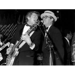  Singers Dave Edmunds and Elton John Performing at the Rock 