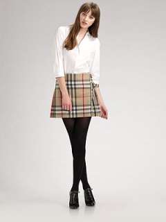   to write a review this cropped a line skirt features ruffle trim and