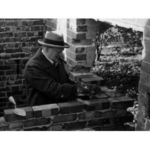 Winston Churchill Building a Brick Doll House for His Youngest 