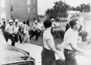 1966 Police w/riot gear chasing youths PHOTO  