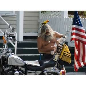 Motorcyclist with Bird on Head, Duval Street, Key West, Florida, USA 