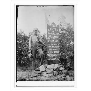   Population of U.S. man standing next to memorial stone