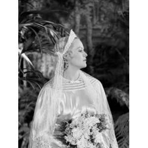  Wearing Tiara, Veil and Silk Wedding Dress, Holding Bridal Bouquet 